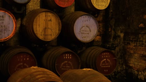 barrels aging in a historic distillery