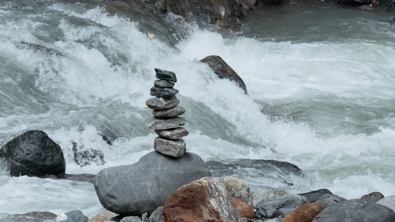 Balanced stones in a mountain stream
