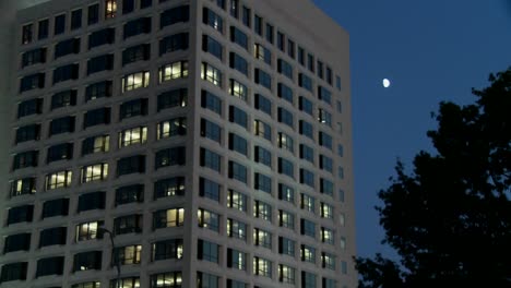 An-office-building-at-night-with-lights-on-inside