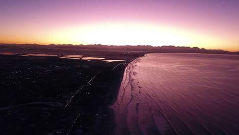 morning sunrise drone flight over muizenberg and sandvlei