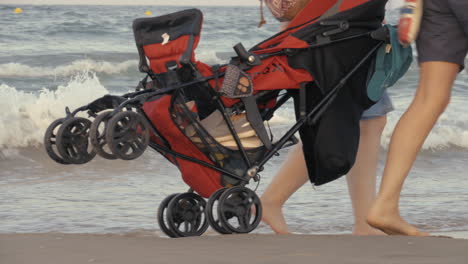 rolling the stroller along the seashore