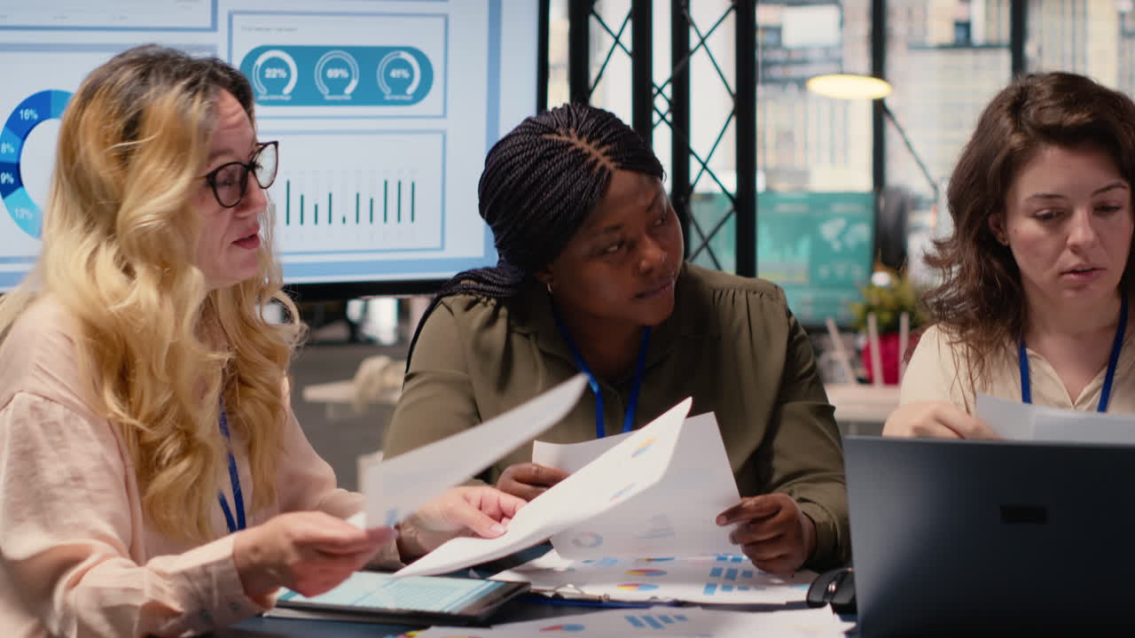Vertical Video Group of businesswomen engaging in collaboration during briefing session
