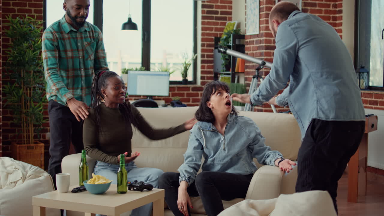 Multiethnic group of people losing video games challenge