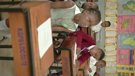 students studying in african school - vertical shot