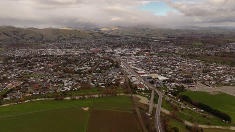 blenheim cityscape and surrounding vineyards, town with hills in background, marlborough, new zealand. aerial drone panoramic view