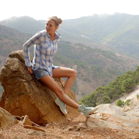 Girl-Resting-Near-Rock-in-Spanish-Mountains