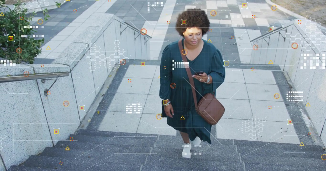 Mid-adult woman ascending steps while scrolling smartphone and activating tech scanning overlay