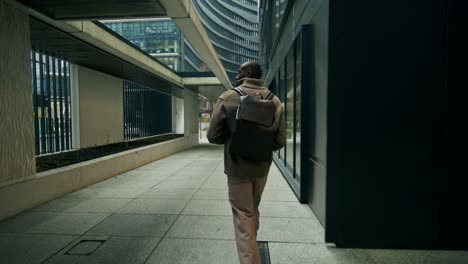 man walking through city streets