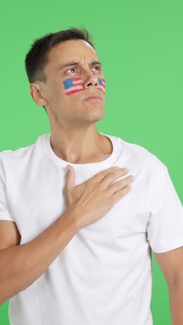 united states patriot listening to the national anthem with solemnity