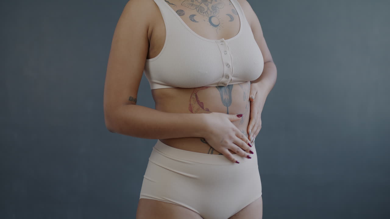 Woman in Undergarments with Tattoos