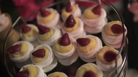 dessert table with strawberry-adorned treats for all tastes