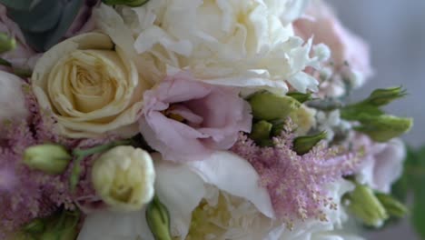 extreme closeup slider shot of a beautiful wedding bride bouquet flowers