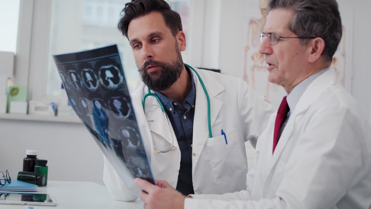 Handheld view of doctors examining the medical record