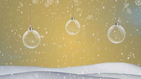 hanging bauble decorations and snow falling over winter landscape against yellow background