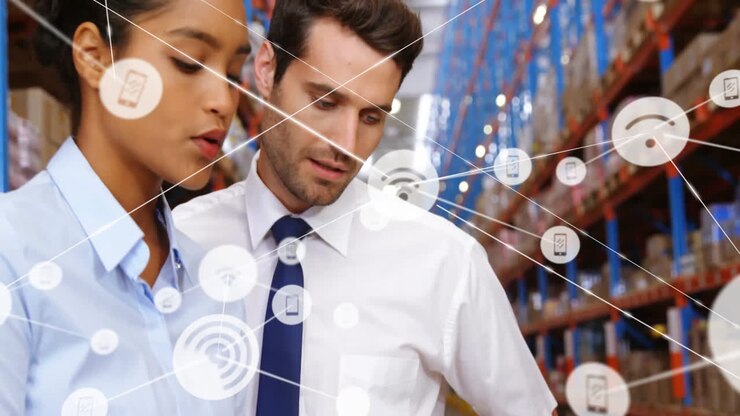 Animation of network of connections with icons over diverse workers talking in warehouse