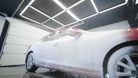 car wash with flowing water and foam.