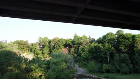 Flying-under-bridge-panning-up