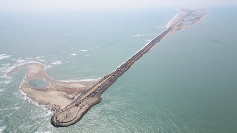 aerial drone shot of dhanushkodi, focusing on the final road of india and the breathtaking seascape around it.