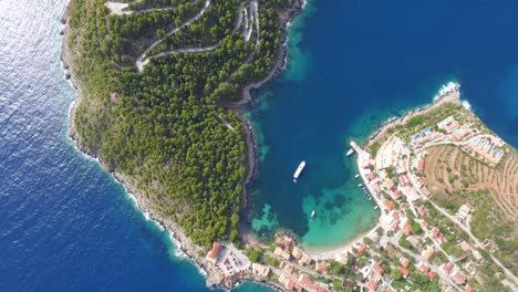 overhead drone shot orbiting around the peninsula of agriosiko beach, a secret getaway in the island of kefalonia in western greece