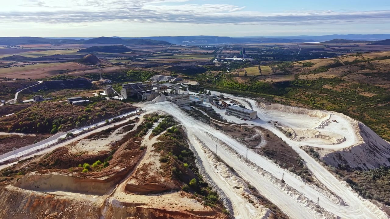 Mining site view showing machinery and landscape during daylight in rural area