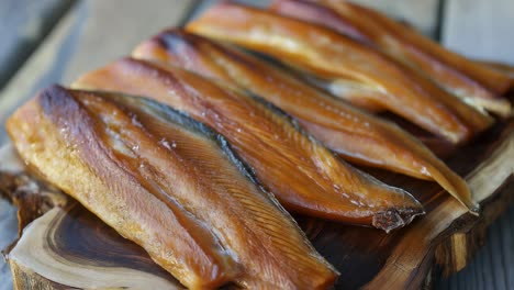 smoked fish on wooden board