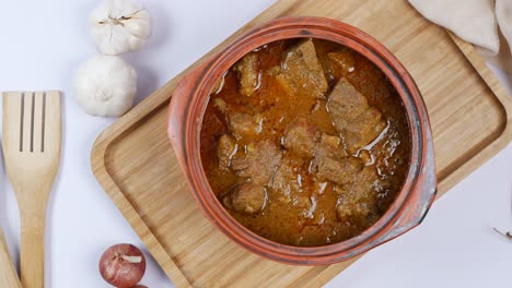 traditional indian curry lamb masala in a bowl on table