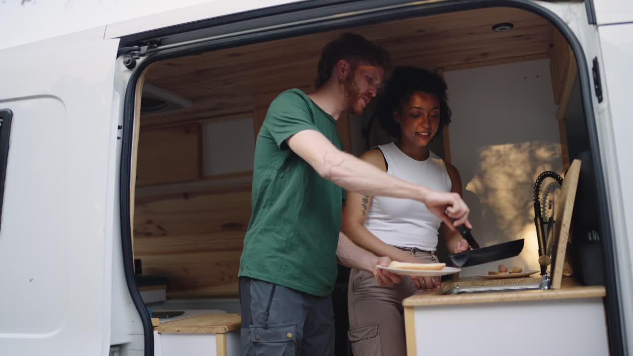 Couple Cooking in Their Van During a Road Trip