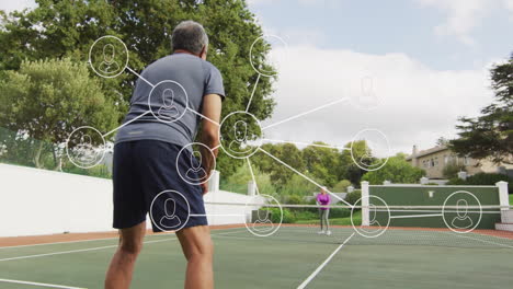 senior couple playing tennis on outdoor court, showcasing sports technology network infographic