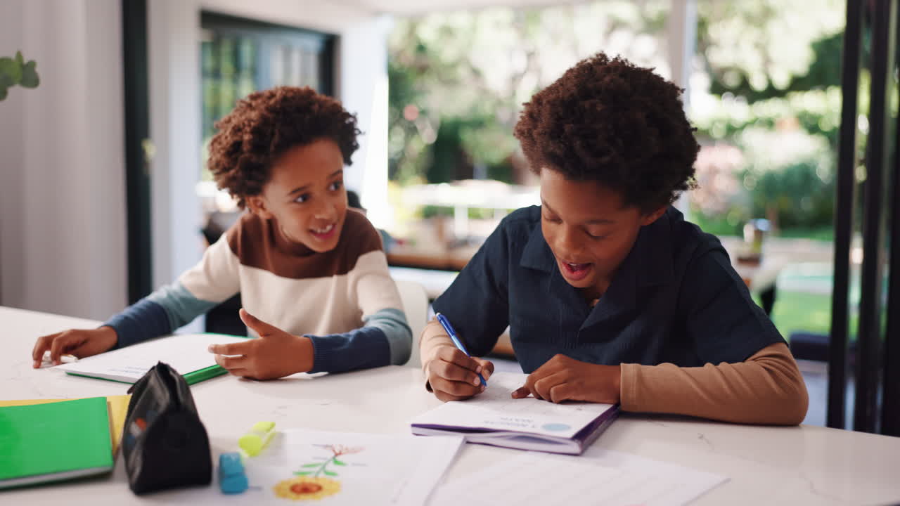 Two boys doing homework at a table