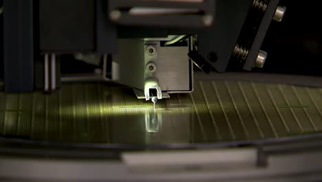 close up of testing a silicon micro-electronic wafer in clean room in lab