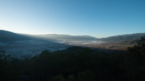 Stunning-sunrise-time-lapse-over-mountain-valley,-Shaxi-China