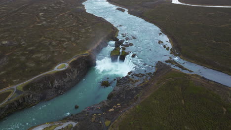 panoramic view over powerful godafoss waterfall in iceland - aerial drone shot