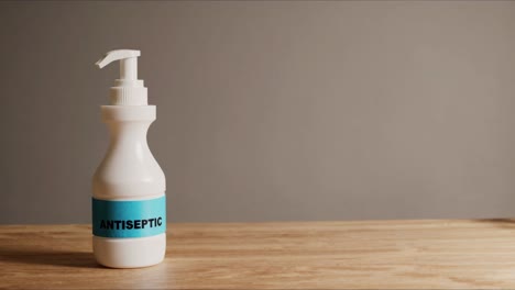 antiseptic hand sanitizer and cardboard figure