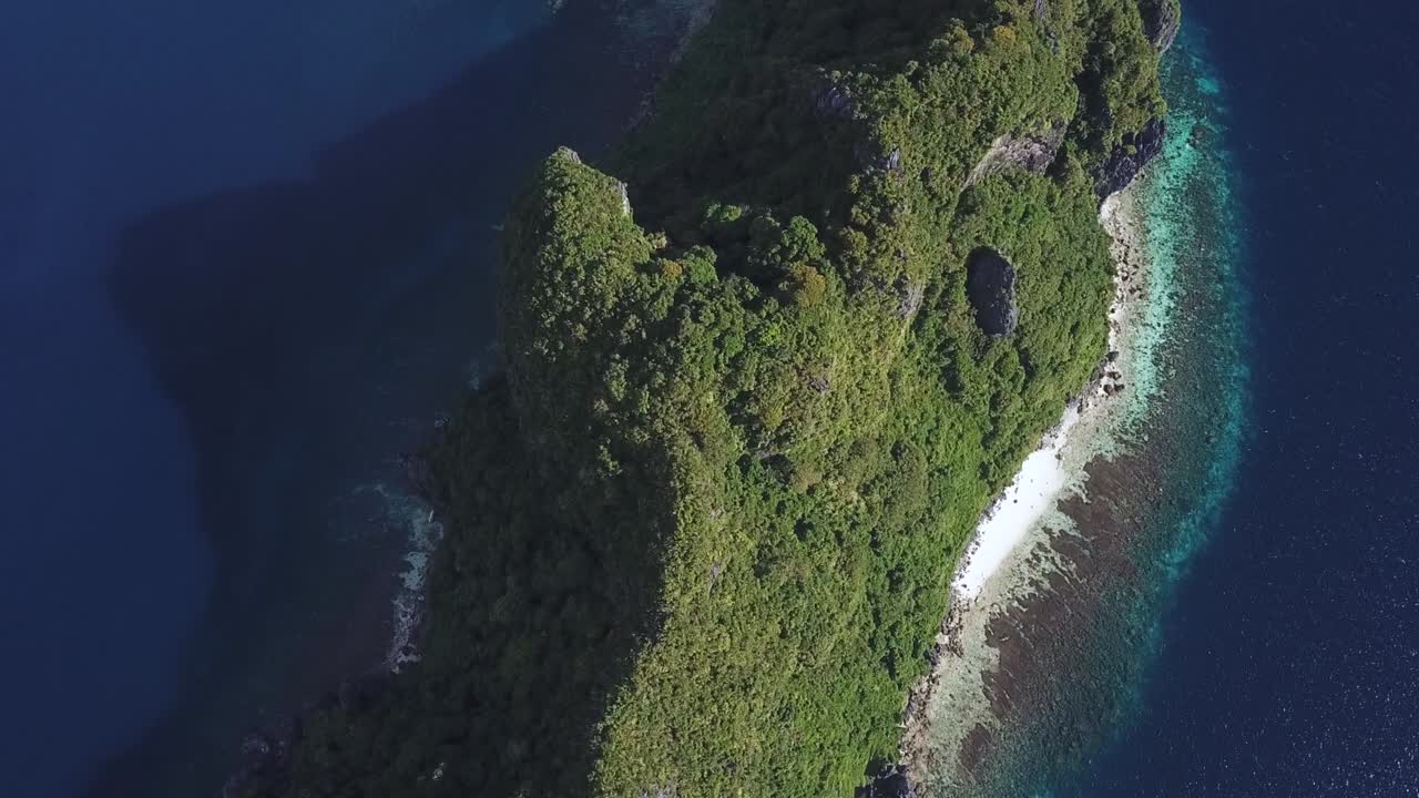 Birdseye Drone Aerial View of Green Rocky Island in El Nido Arhipelago, Palawan, Philippines