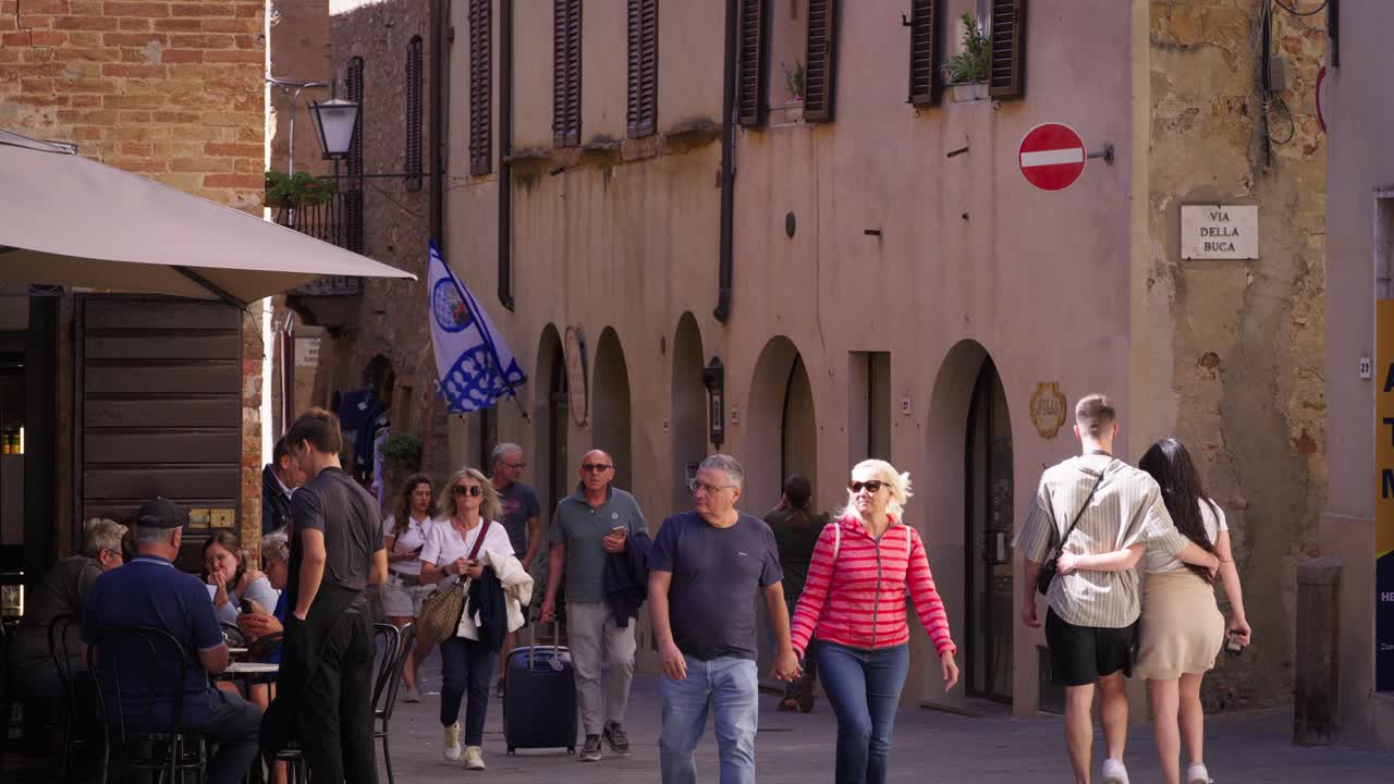 Tourists walking through the streets of Florence, Italy.