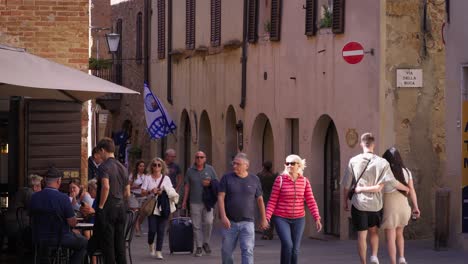 tourists walking through the streets of florence, italy.