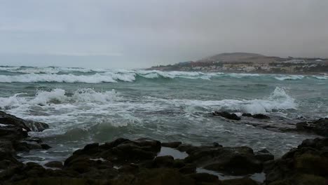 stormy waves hitting the shore