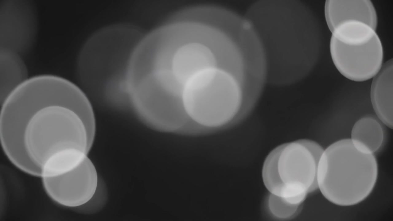 Abstract Black and White Bokeh Light Particles Background