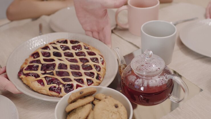 Pie, cookies, and tea on the table
