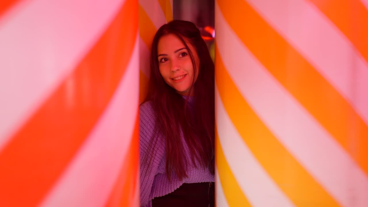 Woman Posing in a Striped Light Tunnel