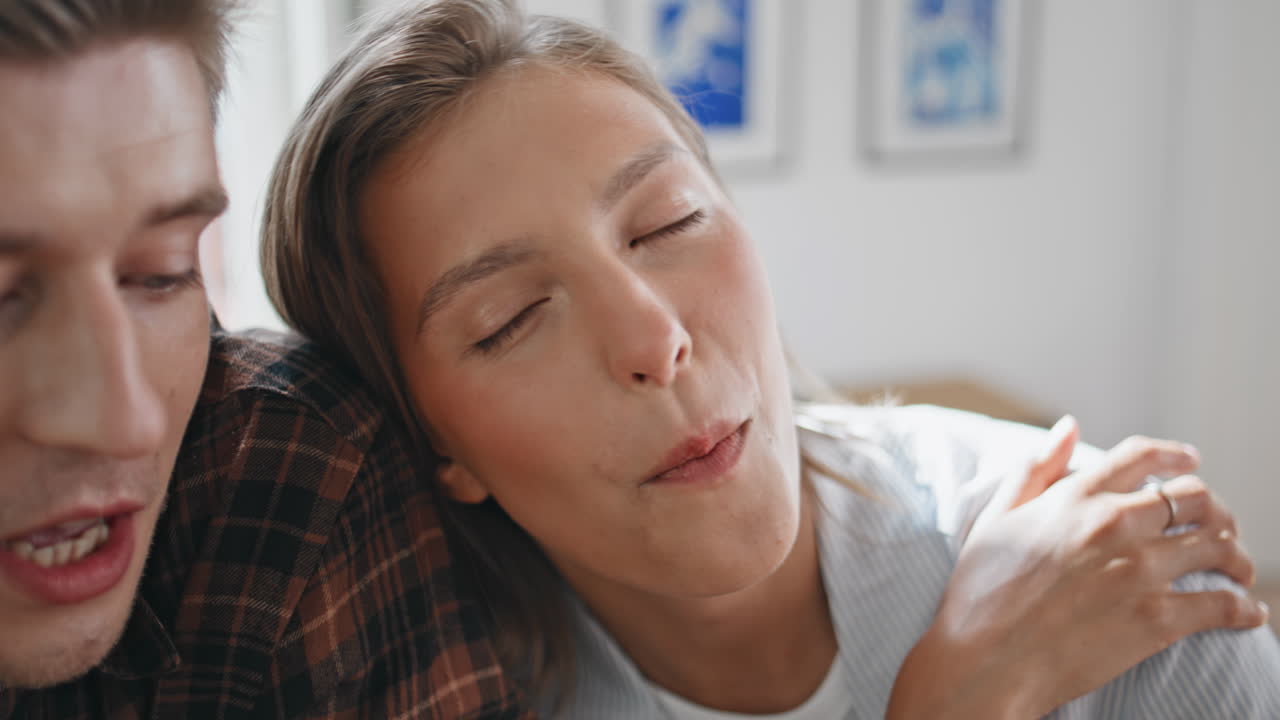 girl eating strawberry with boyfriend closeup. Dreamy lady enjoying