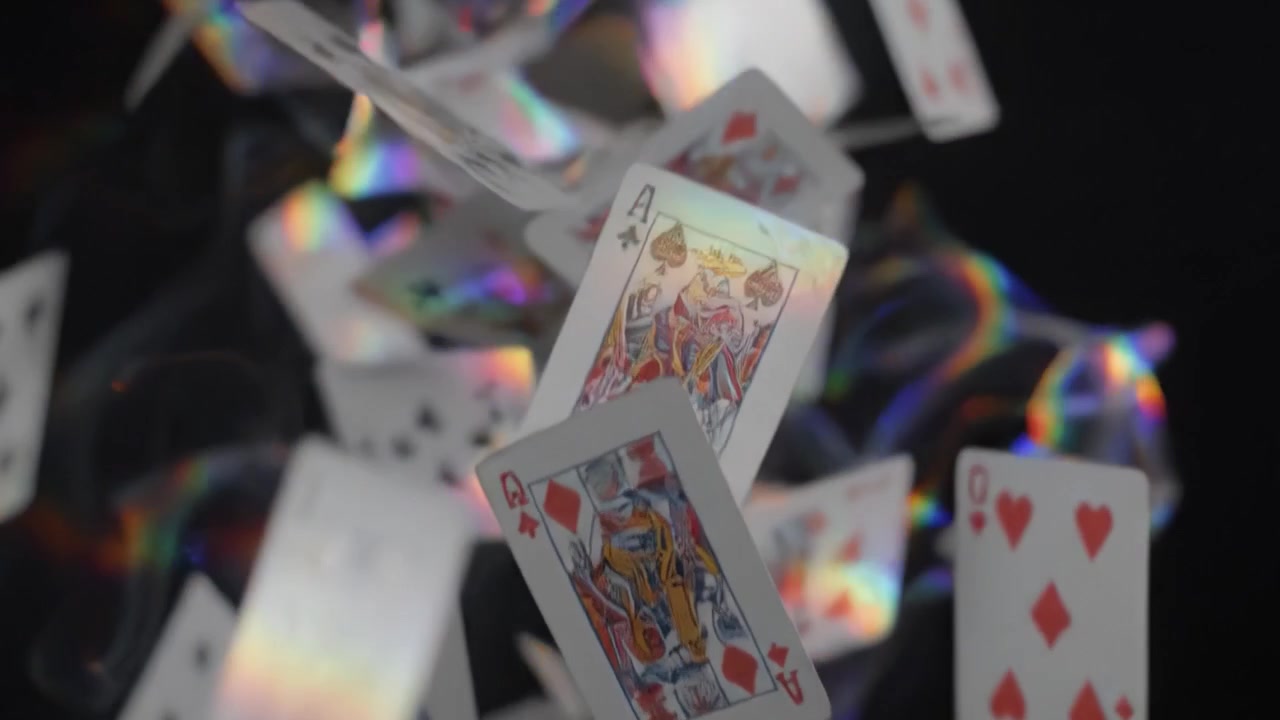 A Dramatic Display of Falling Playing Cards: Captivating Moments as Hearts and Kings Cascade Through the Air, Creating a Mesmerizing Visual Experience