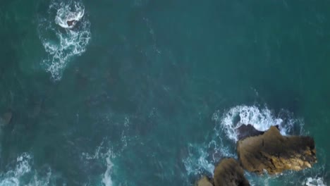 Waves-crashing-on-the-rocks,-Cascais,-Portugal