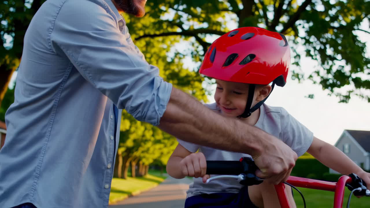 Father teaching his son how to ride a bicycle