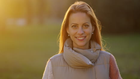 Portrait of a Smiling Woman Outdoors at Sunset
