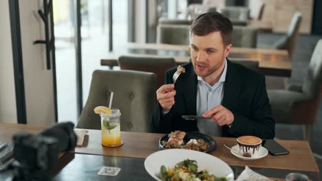 handsome young man enjoys a meal in a restaurant