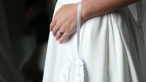 Close-Up-Of-Bride's-Lucky-Horseshoe-And-Wedding-Dress