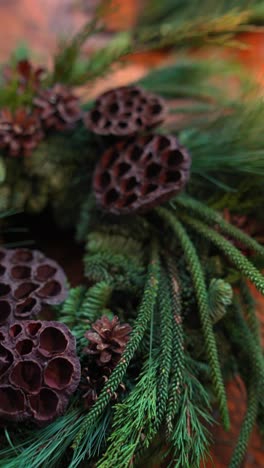 rustic holiday wreath with pine cones and dried lotus pods