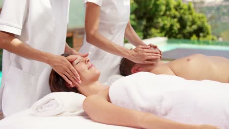couple enjoying a face massage