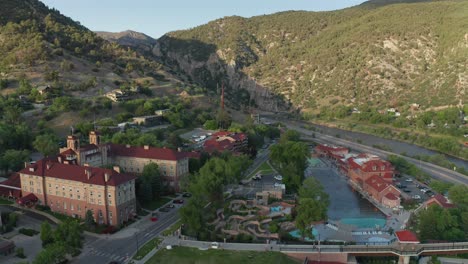 aerial approach of the hotel colorado and the hot springs pool in glenwood springs